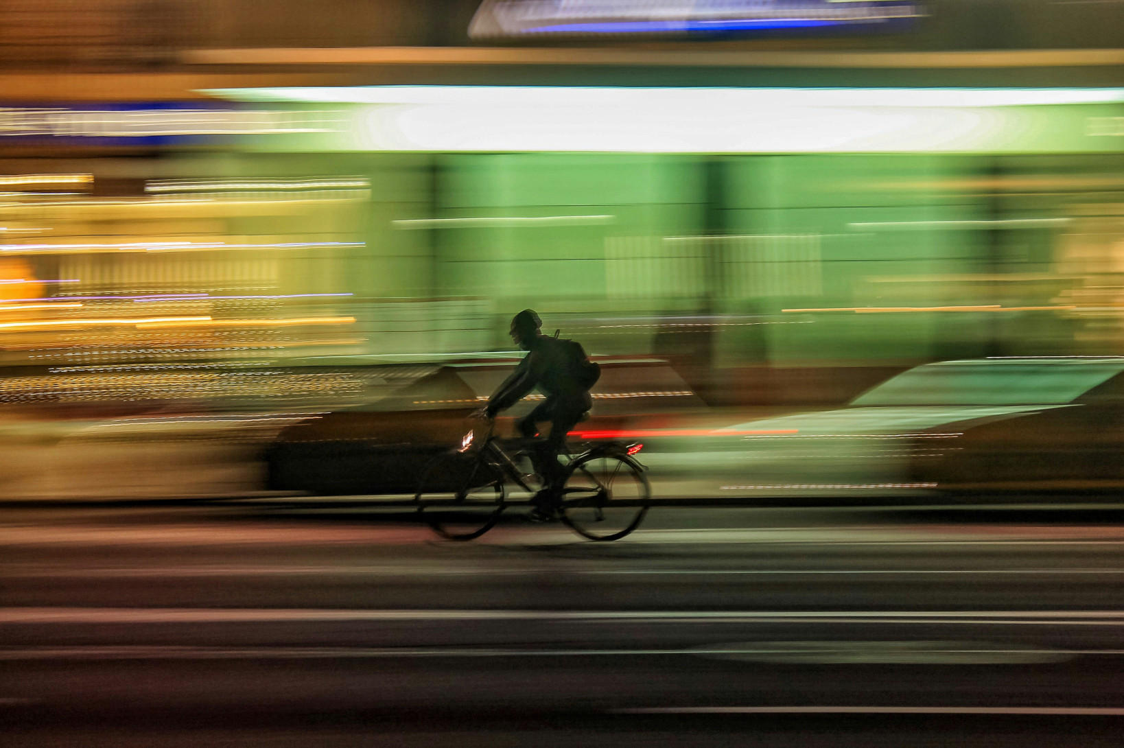 Bike messenger at night